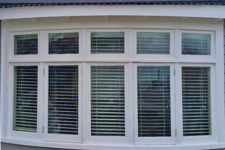 A beautifully restored curved timber window with a fresh white finish and retrofit double glazing. The upgraded windows enhance insulation, reduce noise, and improve energy efficiency while preserving the home's character. The Glaziers Ltd in Auckland specialises in timber window restoration and double glazing retrofits for improved comfort and sustainability.